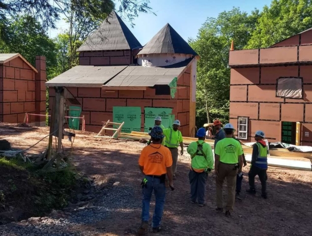 Several workers in hardhats at a jobsite